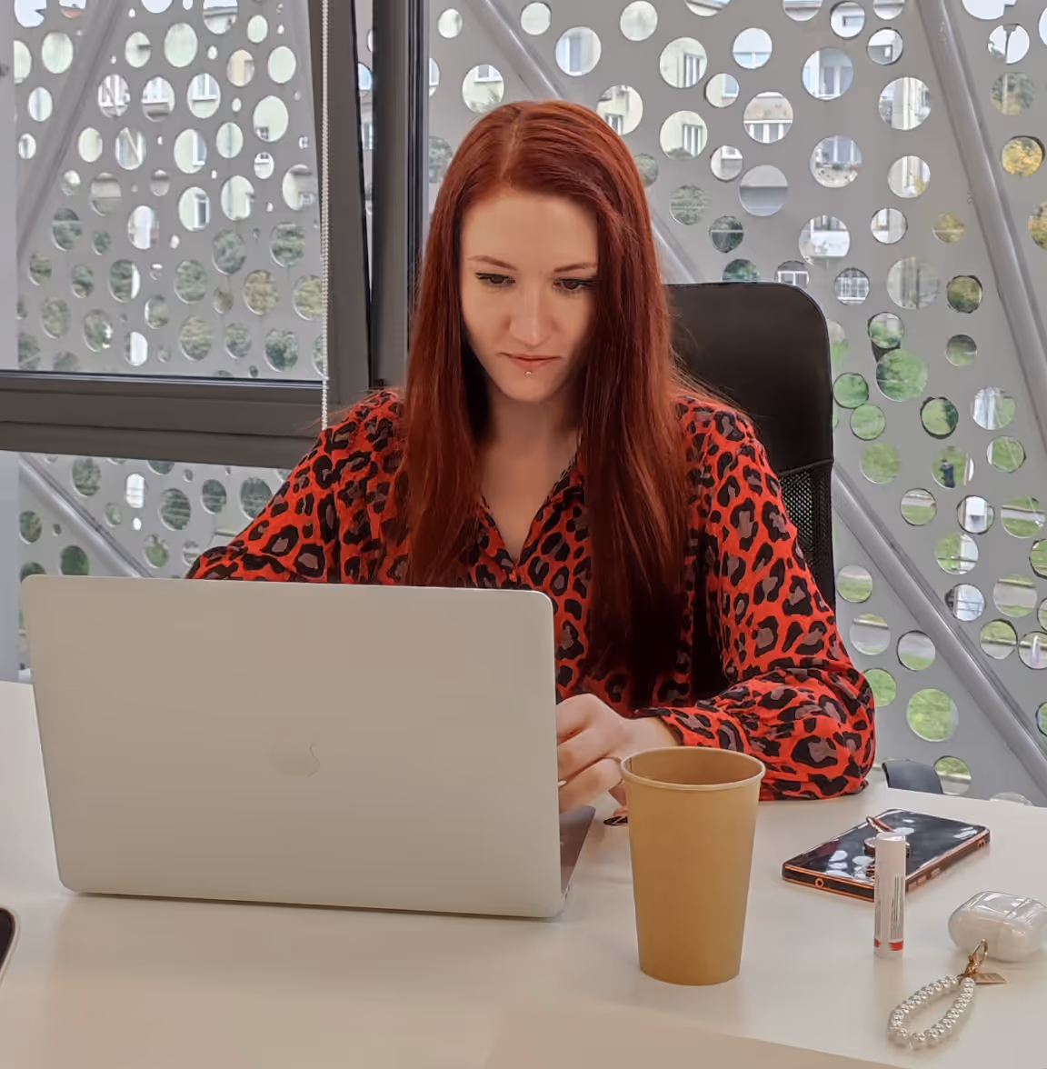 Flexum team member working on a laptop