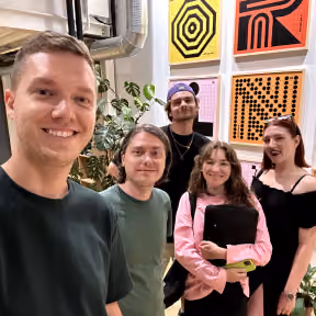 Flexum team taking a selfie at a gallery