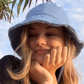 Portrait of a Flexum team member in a bucket hat